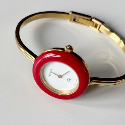 Gucci 1990s Interchangeable Bezel Gold Plated Bangle Watch with 12 bezels, case