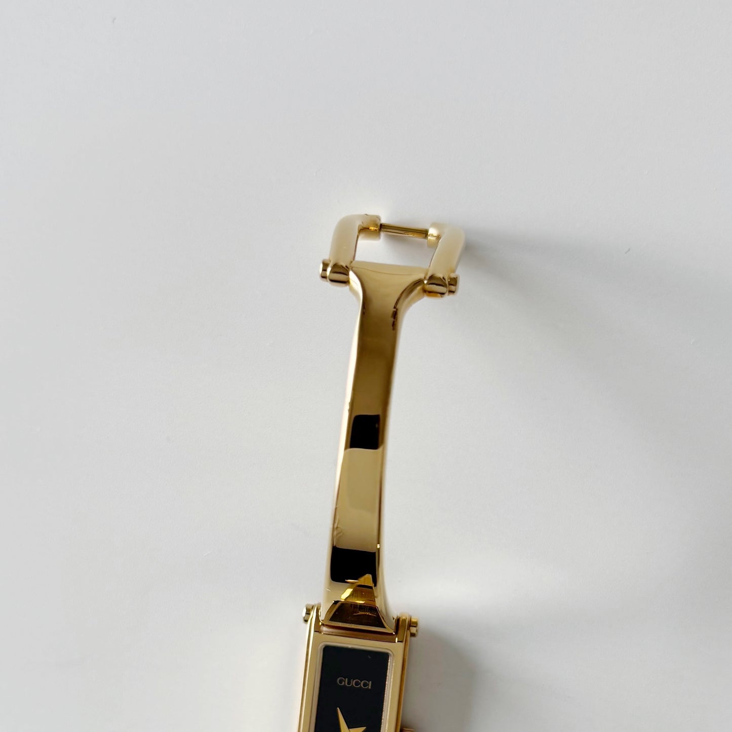 Gucci 1990s Rectangular Black Dial Gold Plated Bangle Watch