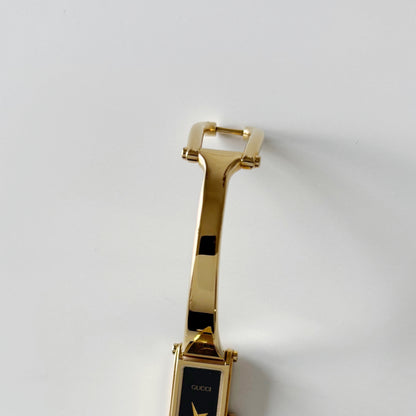 Gucci 1990s Rectangular Black Dial Gold Plated Bangle Watch