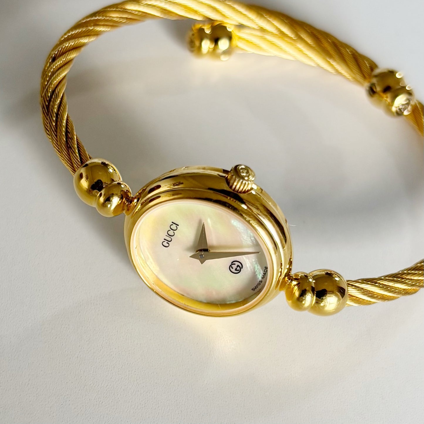 Gucci 1990s Seashell Dial Gold Plated Cable Band Bangle Watch