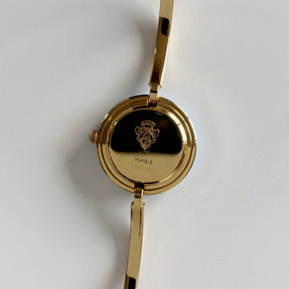 Gucci 1990s Interchangeable Bezel Gold Plated Bangle Watch with 12 bezels, case