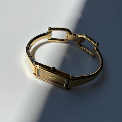 Gucci 1990s Rectangular Gold Dial Gold-Plated Watch