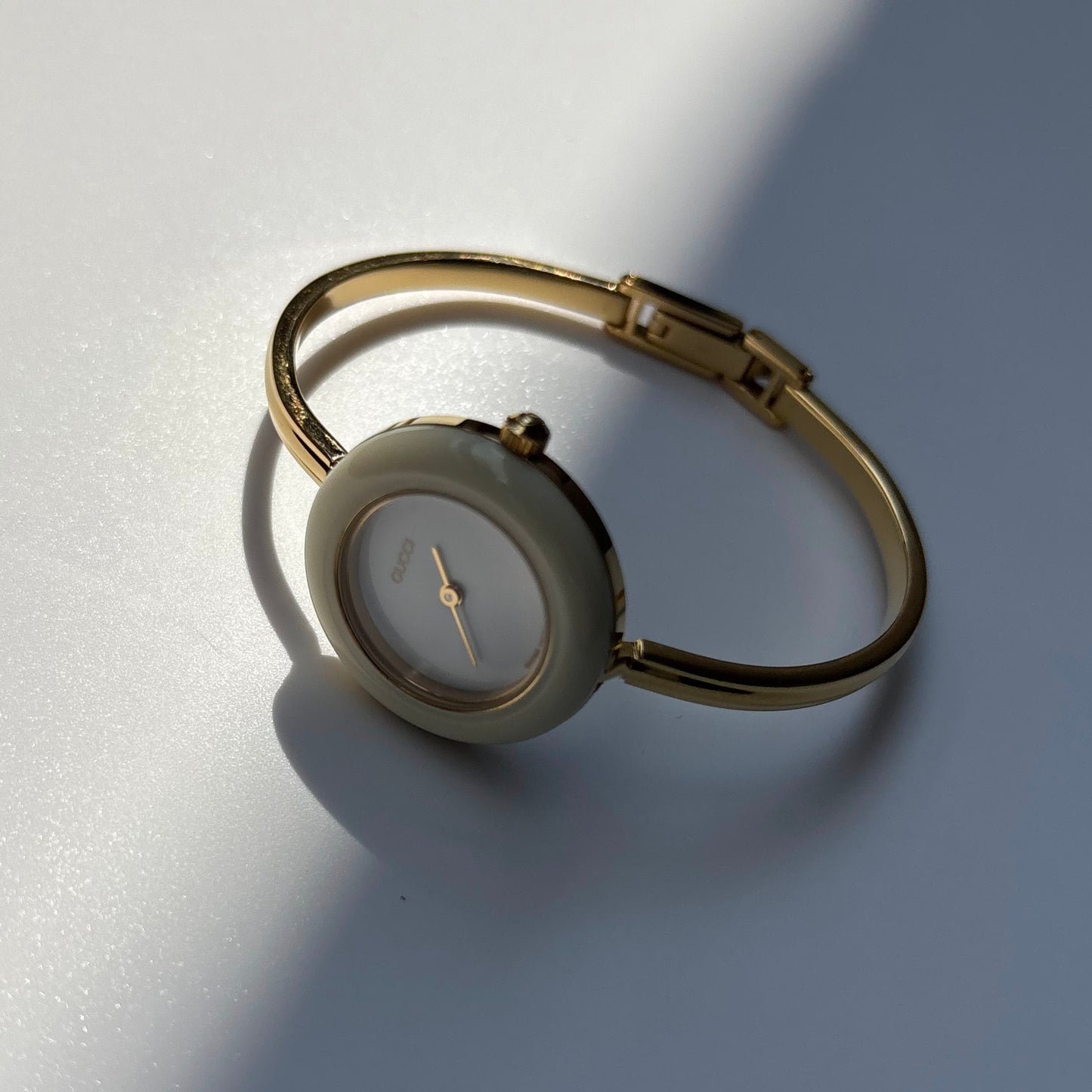 Gucci 1990s Interchangeable Bezel Gold Plated Bangle Watch with 12 bezels, case