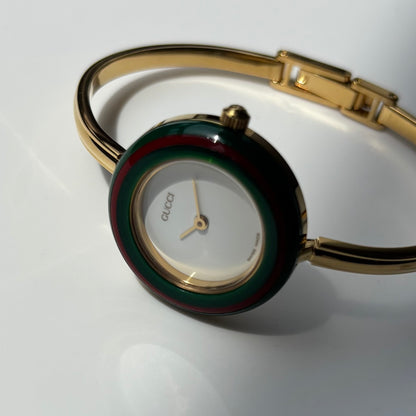 Gucci 1990s Interchangeable Bezel Gold Plated Bangle Watch with 12 bezels, case