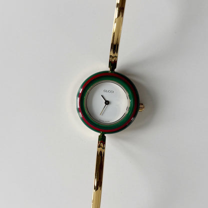 Gucci 1990s Interchangeable Bezel Gold Plated Bangle Watch with 12 bezels, case