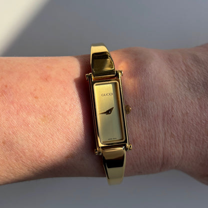 Gucci 1990s Gold Dial Rectangular Gold Plated Bangle Watch