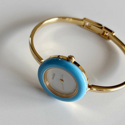 Gucci 1990s Interchangeable Bezel Gold Plated Bangle Watch with 12 bezels, case
