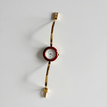 Gucci 1990s Interchangeable Bezel Gold Plated Bangle Watch with 12 bezels, case
