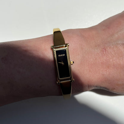 Gucci 1990s Black Rectangular Dial Gold Plated Bangle Watch