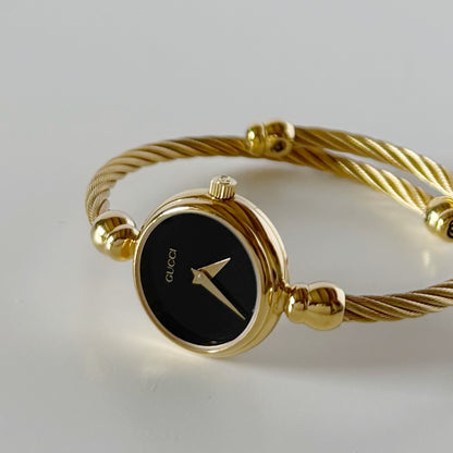 Gucci 1990s Black Dial Gold Plated Cable Bangle Watch