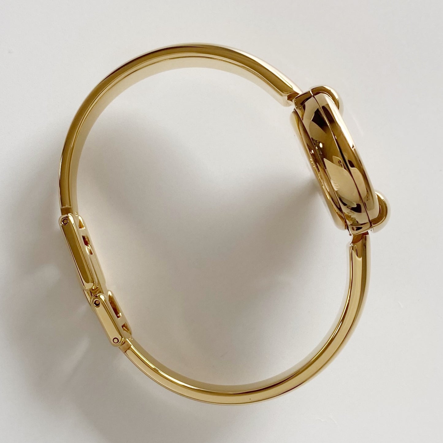 Gucci 1990s Round Dial Gold Plated Bangle Watch