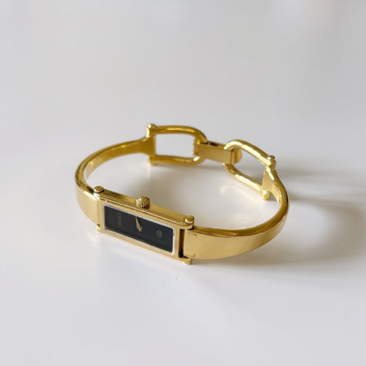 Gucci 1990s Black Dial Rectangular Gold Plated Bangle Watch