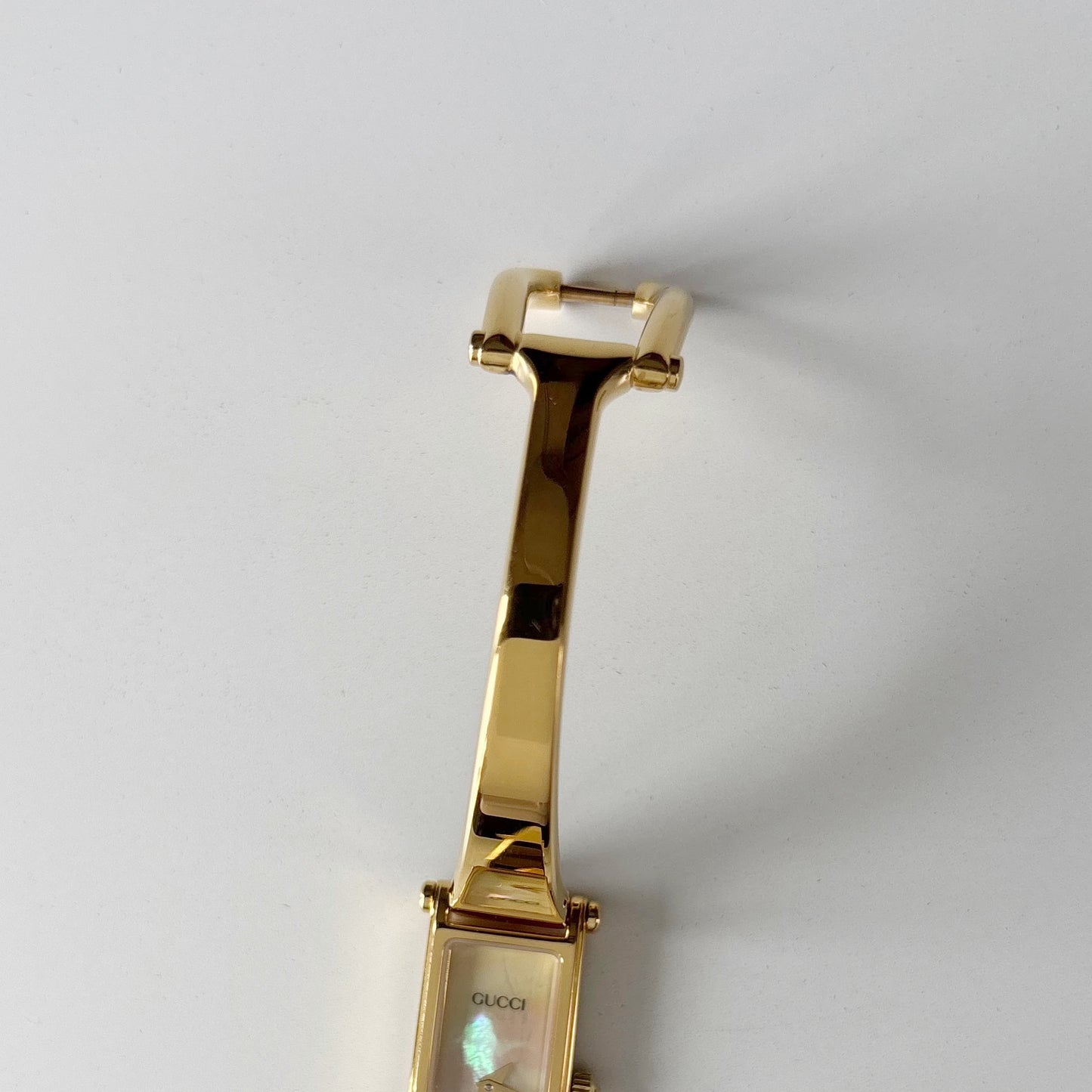 Gucci 1990s Seashell Rectangular Dial Gold Plated Bangle Watch