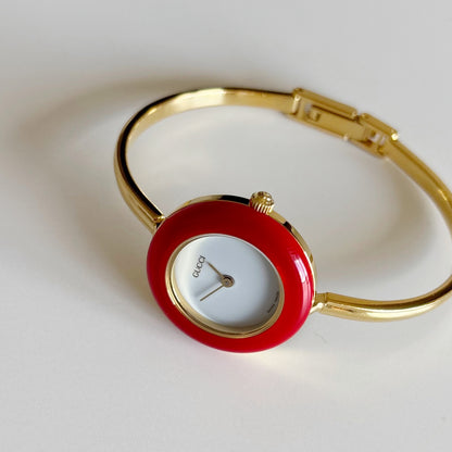 Gucci 1990s Interchangeable Bezel Gold Plated Bangle Watch with 12 bezels, case