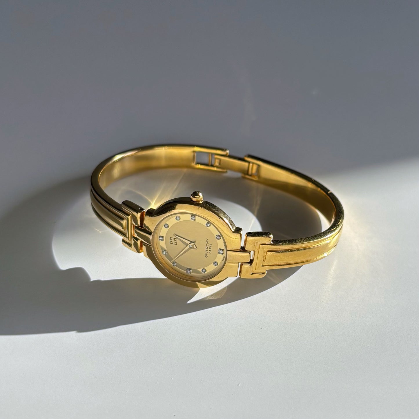Givenchy 1990s Round Dial Gold Plated Bangle Watch