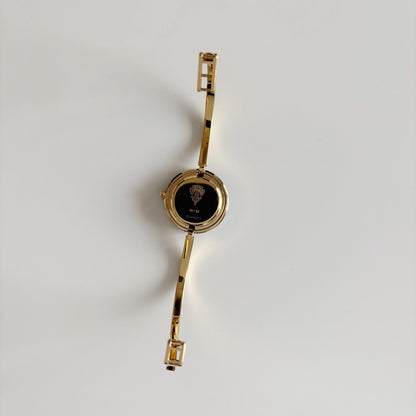 Gucci 1990s Interchangeable Bezel Gold Plated Bangle Watch with 12 bezels, case