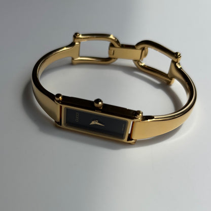 Gucci 1990s Black Rectangular Dial Gold Plated Bangle Watch