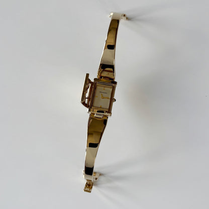 Yves Saint Laurent 1990s Peek-A-Boo Gold Plated Bangle Watch