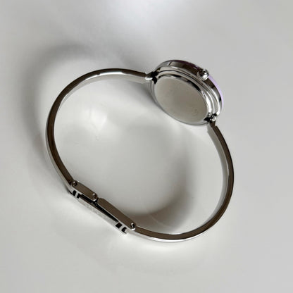 Gucci 1990s Interchangeable Bezel Stainless Steel Bangle Watch with 12 bezels, case