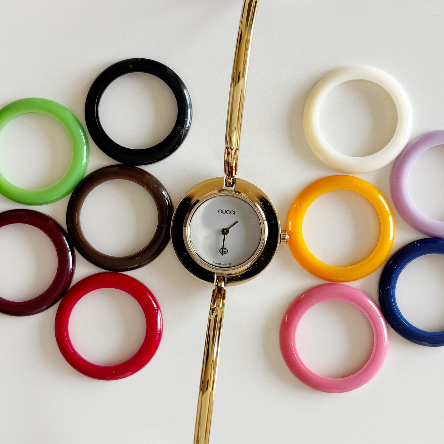 Gucci 1990s Interchangeable Bezel Gold Plated Bangle Watch with 12 bezels, case
