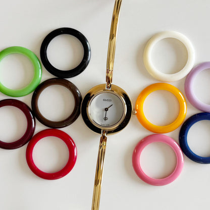Gucci 1990s Interchangeable Bezel Gold Plated Bangle Watch with 12 bezels, case