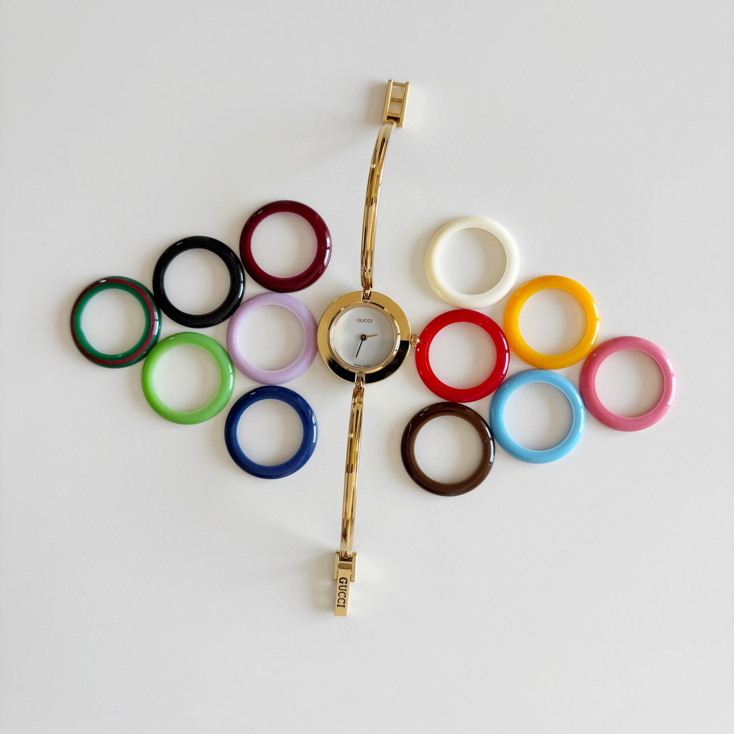 Gucci 1990s Interchangeable Bezel Gold Plated Bangle Watch with 12 bezels, case