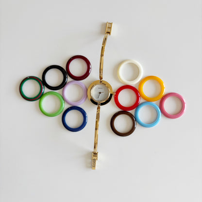 Gucci 1990s Interchangeable Bezel Gold Plated Bangle Watch with 12 bezels, case