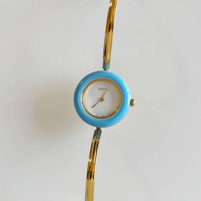 Gucci 1990s Interchangeable Bezel Gold Plated Bangle Watch with 12 bezels, case