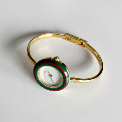 Gucci 1990s Interchangeable Bezel Gold Plated Bangle Watch with 12 bezels, case