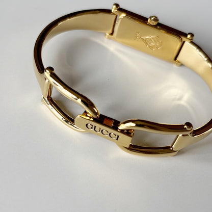 Gucci 1990s Gold Rectangular Dial Gold Plated Bangle Watch