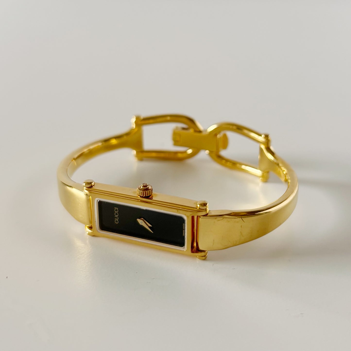 Gucci 1990s Black Rectangular Dial Gold Plated Bangle Watch