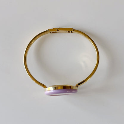 Gucci 1990s Interchangeable Bezel Gold Plated Bangle Watch with 12 bezels, case