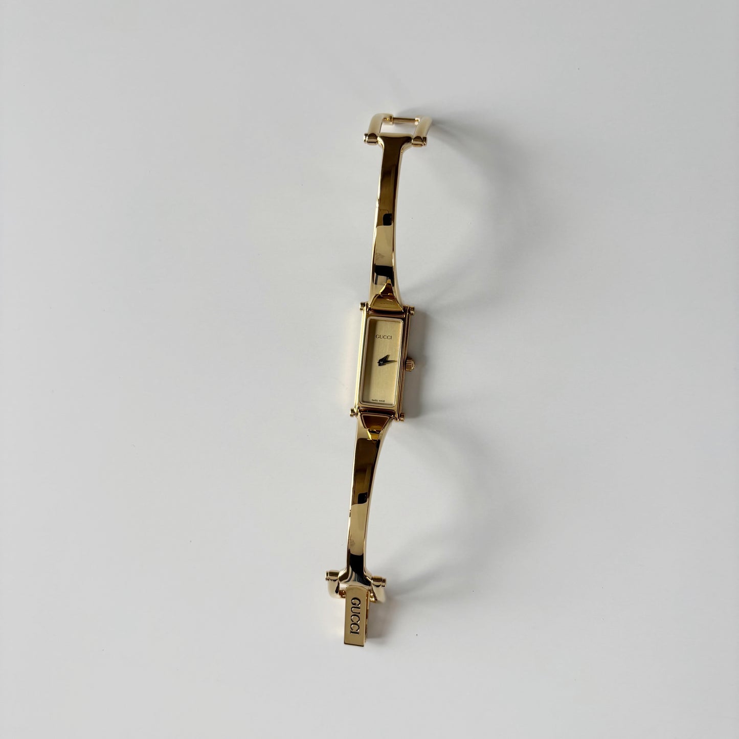 Gucci 1990s Gold Rectangular Dial Gold Plated Bangle Watch