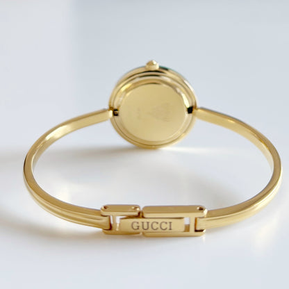 Gucci 1990s Interchangeable Bezel Gold Plated Bangle Watch with 12 bezels, case