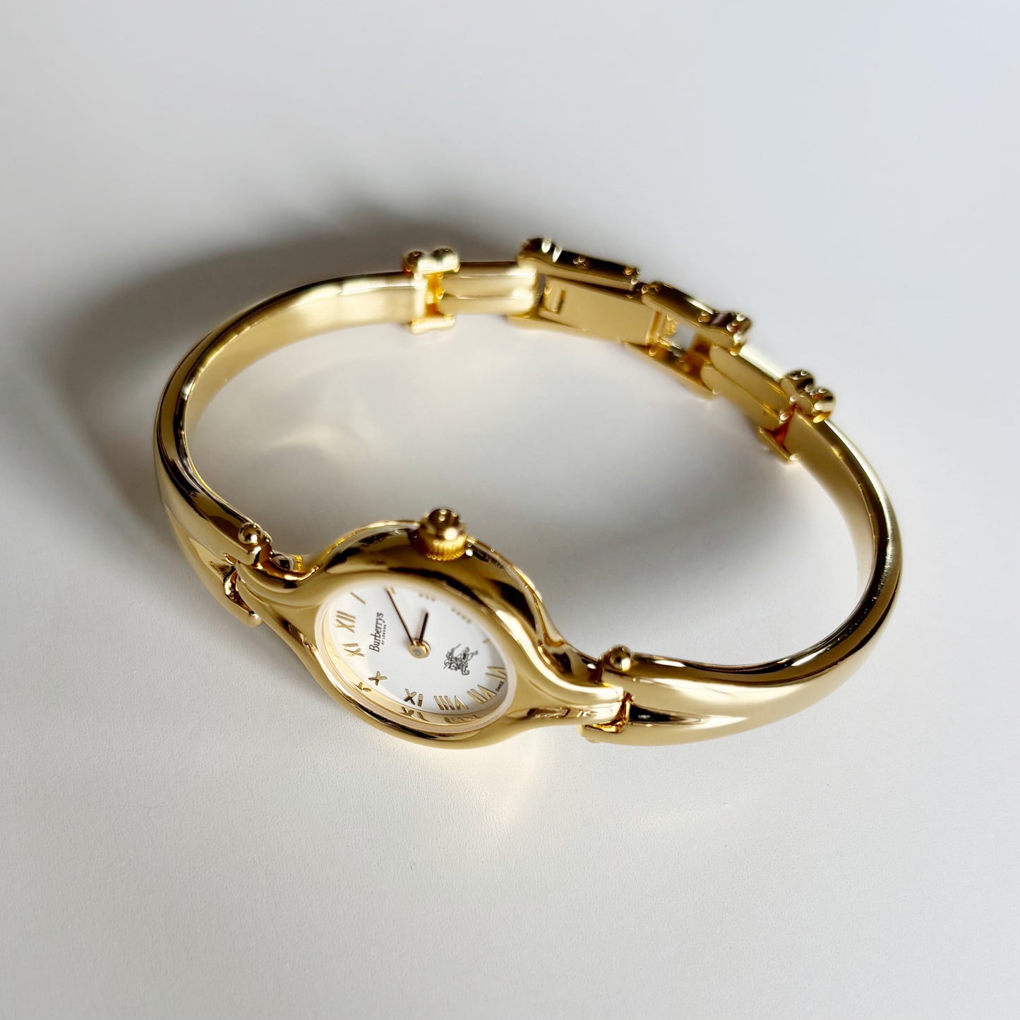 Burberry 1990s Round Dial Gold Plated Bangle Watch