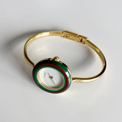 Gucci 1990s Interchangeable Bezel Gold Plated Bangle Watch with 12 bezels, case