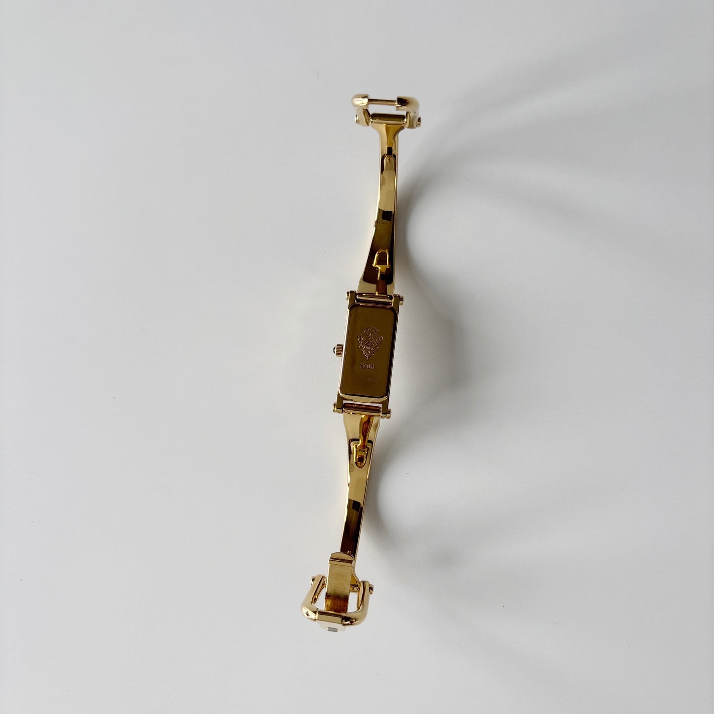 Gucci 1990s Gold Rectangular Dial Gold Plated Bangle Watch
