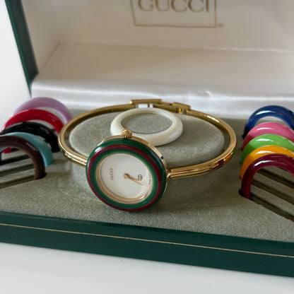 Gucci 1990s Interchangeable Bezel Gold Plated Bangle Watch with 12 bezels, case