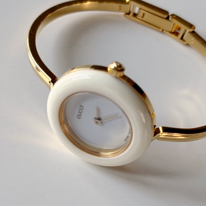 Gucci 1990s Interchangeable Bezel Gold Plated Bangle Watch with case, 12 bezels (Small)