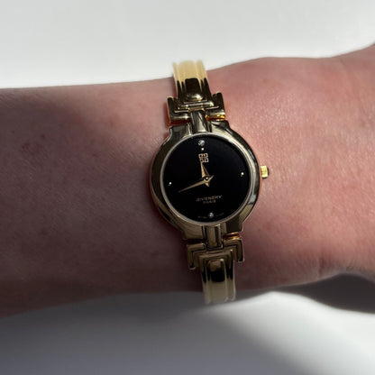 Givenchy 1990s Black Round Dial Gold Plated Bangle Watch