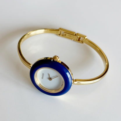 Gucci 1990s Interchangeable Bezel Gold Plated Bangle Watch with 12 bezels, case