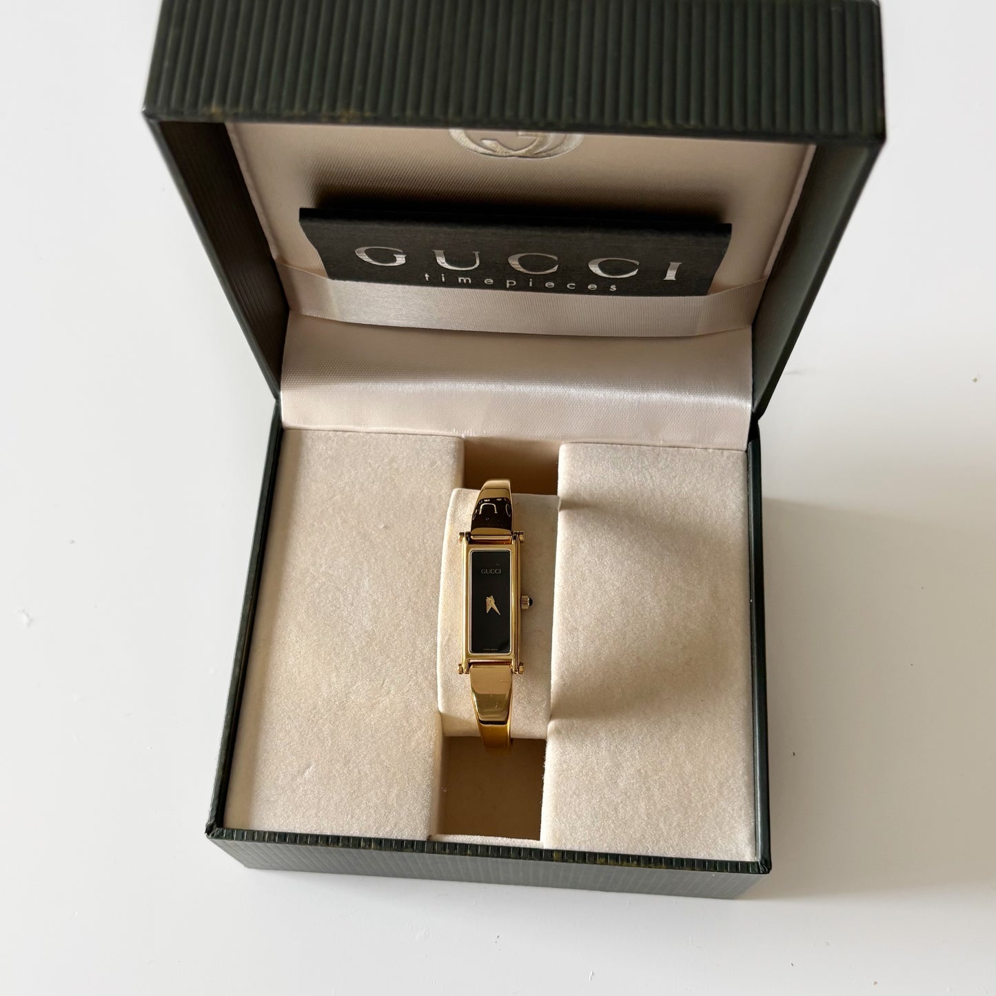 Gucci 1990s Black Dial Rectangular Gold Plated Bangle Watch