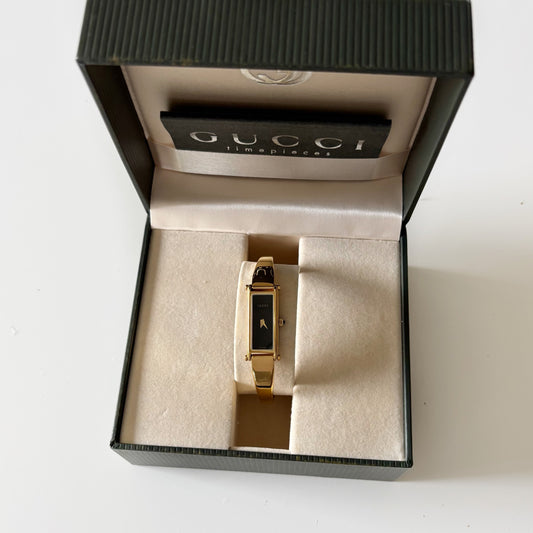 Gucci 1990s Black Dial Rectangular Gold Plated Bangle Watch
