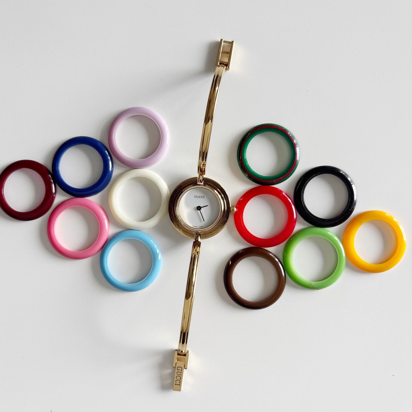 Gucci 1990s Interchangeable Bezel Gold Plated Bangle Watch with 12 bezels, case