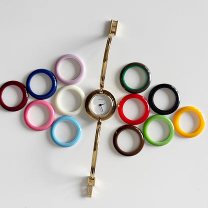 Gucci 1990s Interchangeable Bezel Gold Plated Bangle Watch with 12 bezels, case