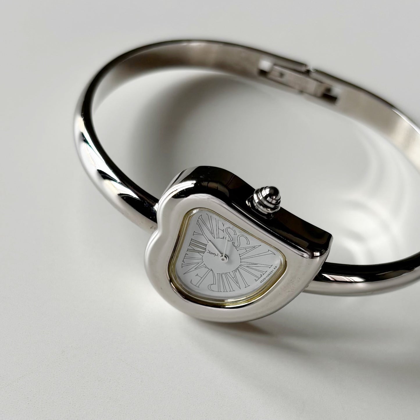 Yves Saint Laurent 1990s Heart Shaped Dial Silver Bangle Watch