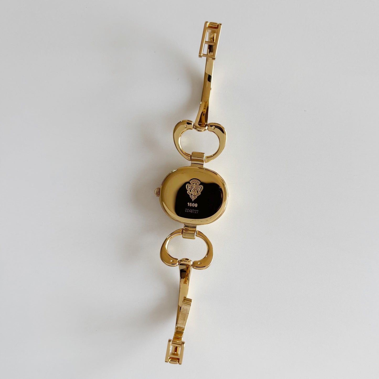 Gucci 1990s Oval Black Dial Gold Plated Bangle Watch (Small)