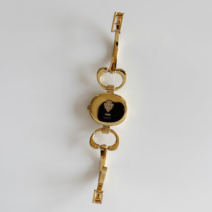 Gucci 1990s Oval Black Dial Gold Plated Bangle Watch (Small)
