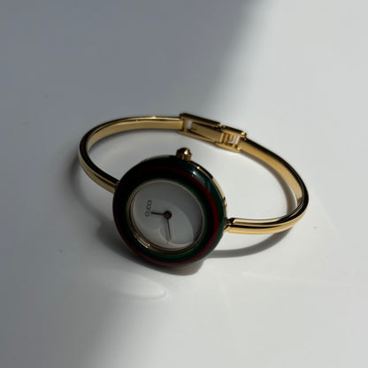 Gucci 1990s Interchangeable Bezel Gold Plated Bangle Watch with 12 bezels, case