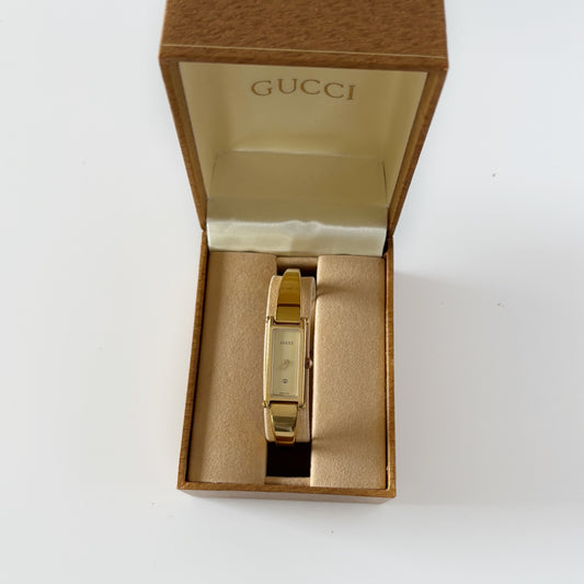 Gucci 1990s Gold Rectangular Dial Gold Plated Bangle Watch